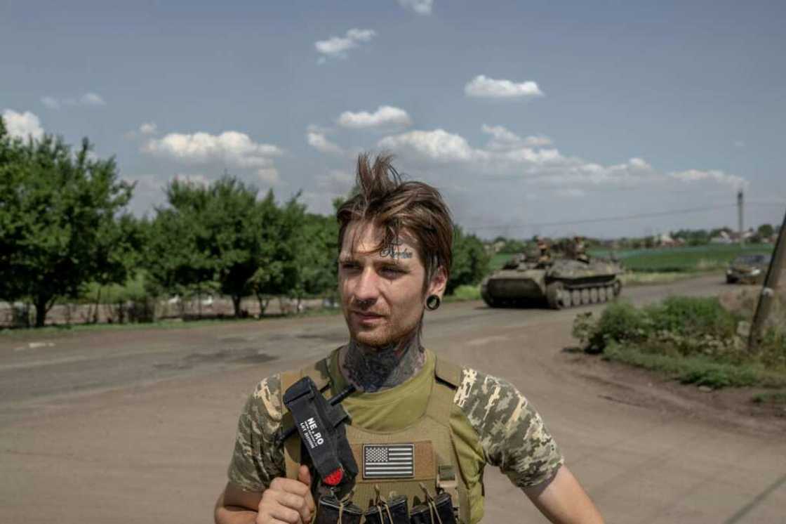The word 'Freedom' is etched in cursive tattoo ink on Ukrainian soldier Mykhailo's forehead The word 'Freedom' is etched in cursive tattoo ink on Ukrainian soldier Mykhailo's forehead