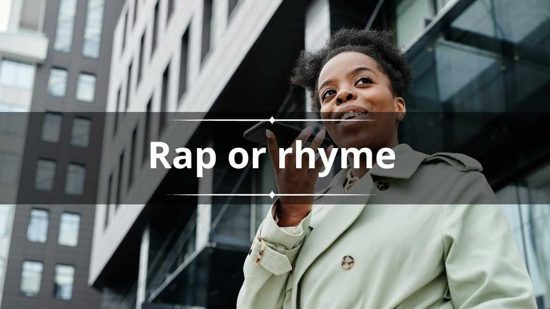 A woman in a pastel green coat records something on her phone A woman in a pastel green coat records something on her phone