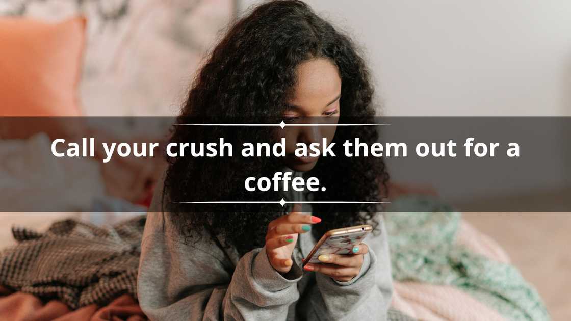 A lady in a grey hoodie and long black hair is texting from bed A lady in a grey hoodie and long black hair is texting from bed