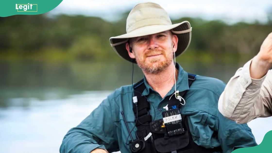 Sean Foley stands in front of a water body
