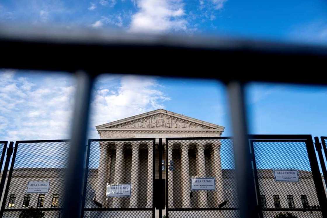 The US Supreme Court, protected from protesters by temporary fencing The US Supreme Court, protected from protesters by temporary fencing