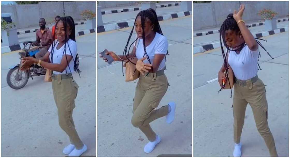 Nigerian lady in NYSC uniform jumps on Buga by Kizz Daniel in the middle of the road. Nigerian lady in NYSC uniform jumps on Buga by Kizz Daniel in the middle of the road.