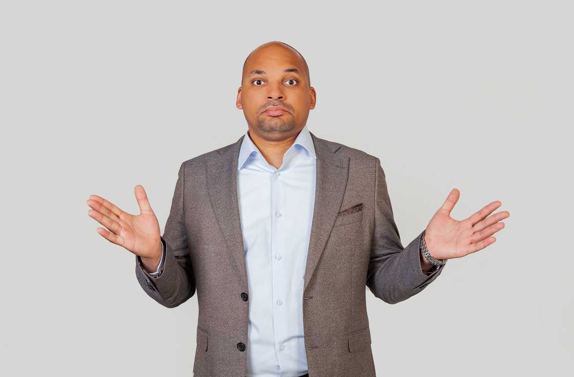 A man shrugging his shoulders A man shrugging his shoulders