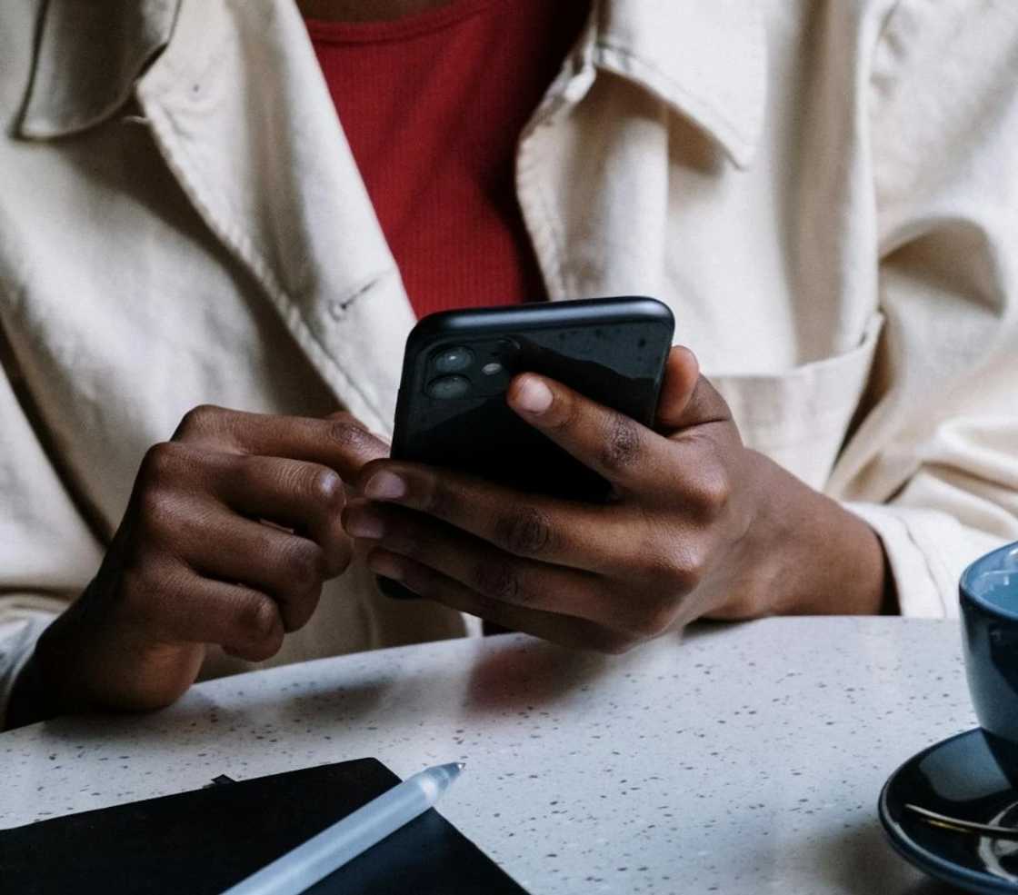A woman gathering evidence in her smartphone