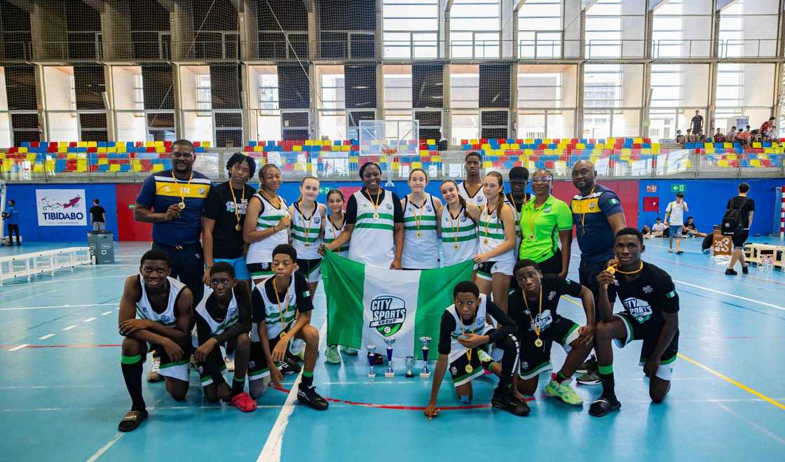 City Sports Africa basketball teams posing for a photo on the court City Sports Africa basketball teams posing for a photo on the court