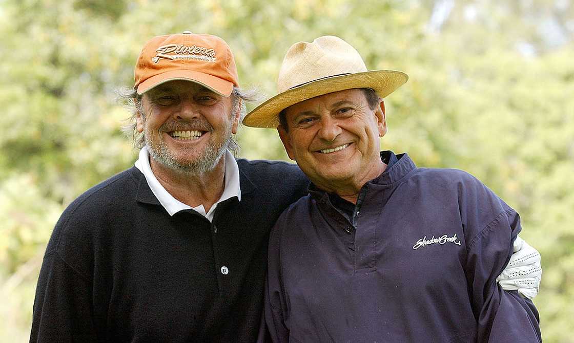 Joe Pesci (R) enjoys a moment with a friend during a golf session Joe Pesci (R) enjoys a moment with a friend during a golf session
