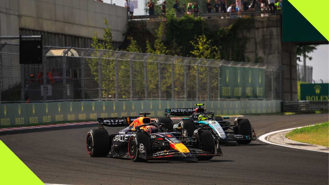 Max Verstappen and Lewis Hamilton at the Hungary F1 Grand Prix. Max Verstappen and Lewis Hamilton at the Hungary F1 Grand Prix.
