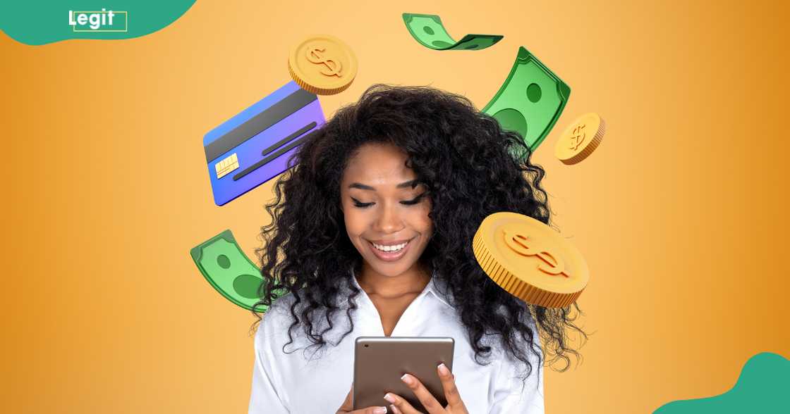 An African businesswoman uses a tablet as a credit card, falling coins and banknotes circle her head. An African businesswoman uses a tablet as a credit card, falling coins and banknotes circle her head.