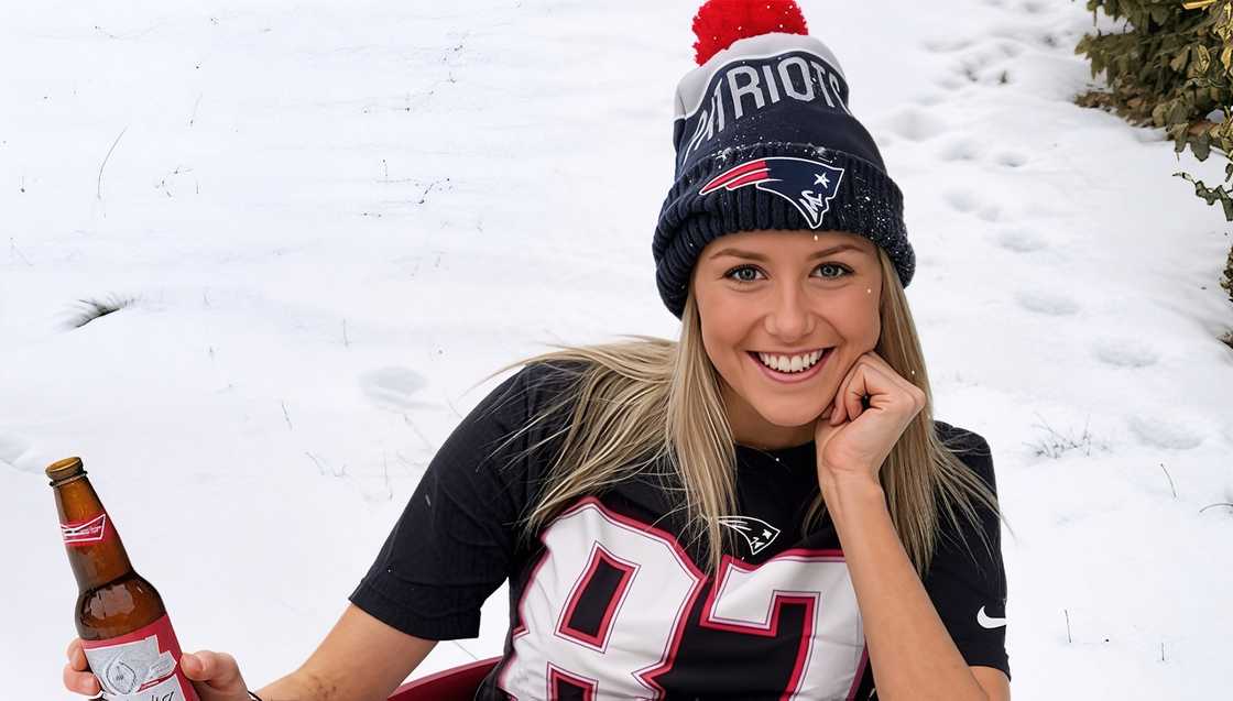 Makena White holds her chin in a pose against a background of snow. Makena White holds her chin in a pose against a background of snow.