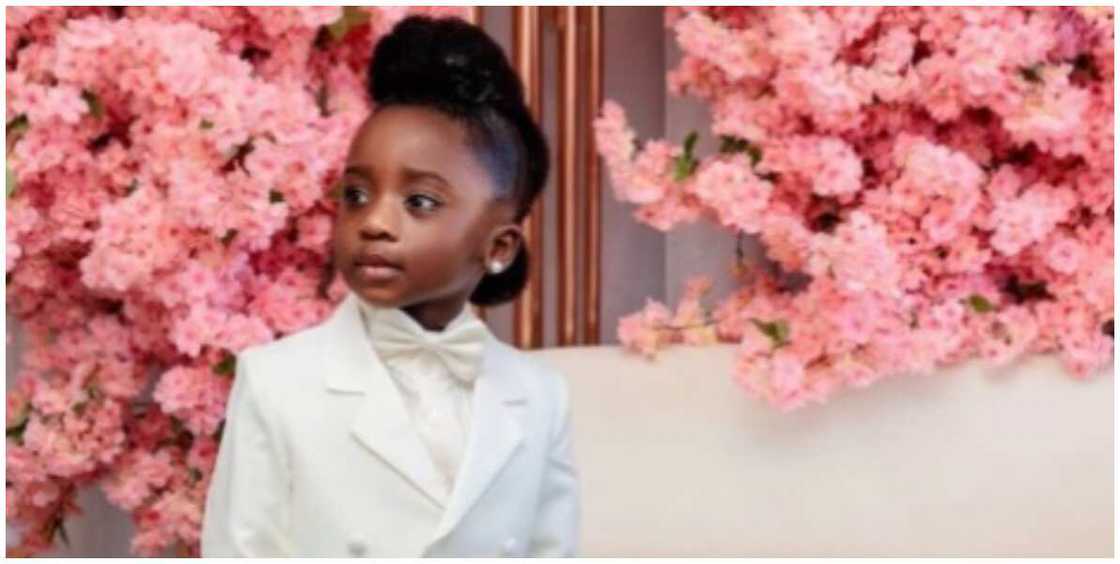 Photo of a little girl dressed as a ringbearer. Photo of a little girl dressed as a ringbearer.