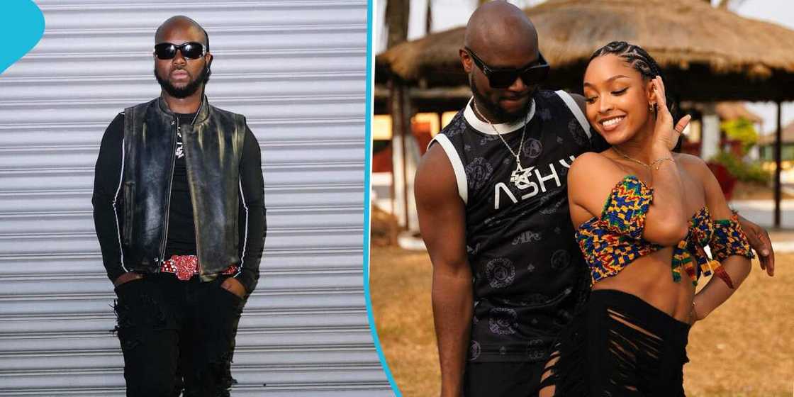King Promise poses with a model King Promise poses with a model