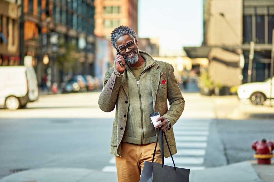 A black man is smiling