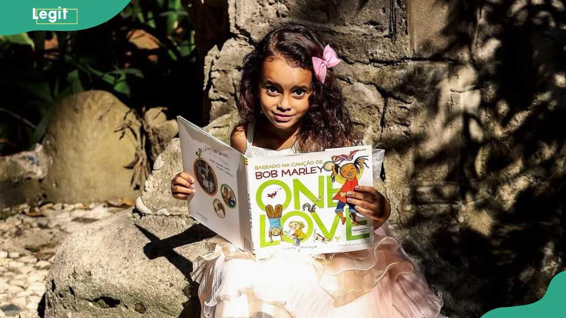 Maria Cedella Marley reads a children's book