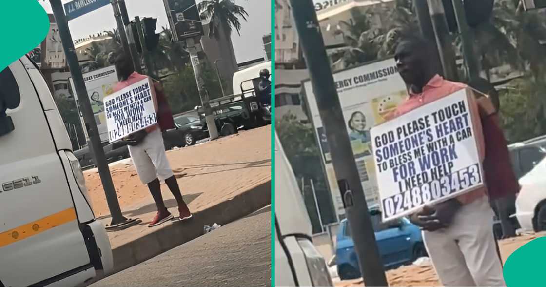 Man spotted with placard on street as he begs for car to use for work Man spotted with placard on street as he begs for car to use for work
