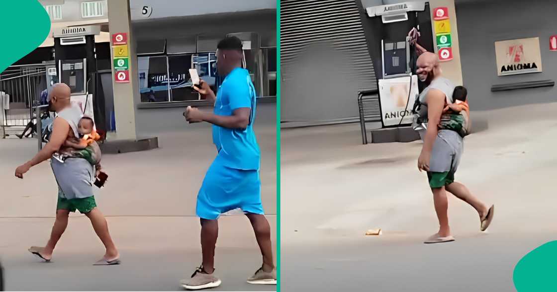 Video shows man on Anambra road with baby on his back Video shows man on Anambra road with baby on his back