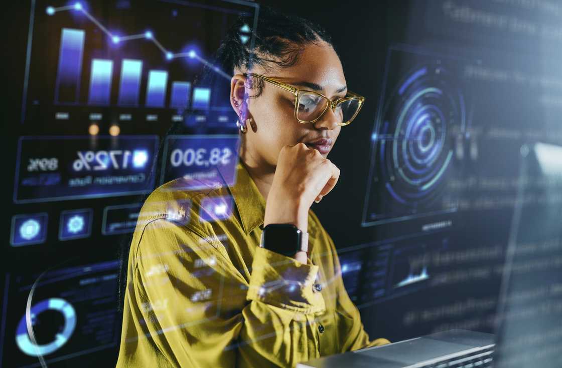 A lady working late at night focused on data analysis