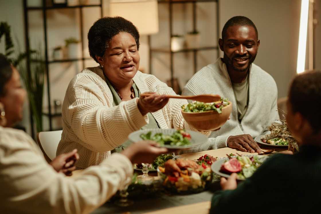 A family shares dinner during introduction