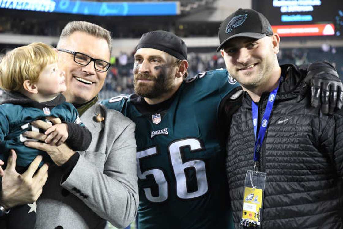 Chris Long, his father Howie Long, and brother Kyle Long. Chris Long, his father Howie Long, and brother Kyle Long.