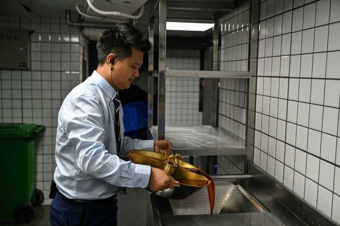 The leftover hotpot broth goes through a special filter that separates oil from water The leftover hotpot broth goes through a special filter that separates oil from water
