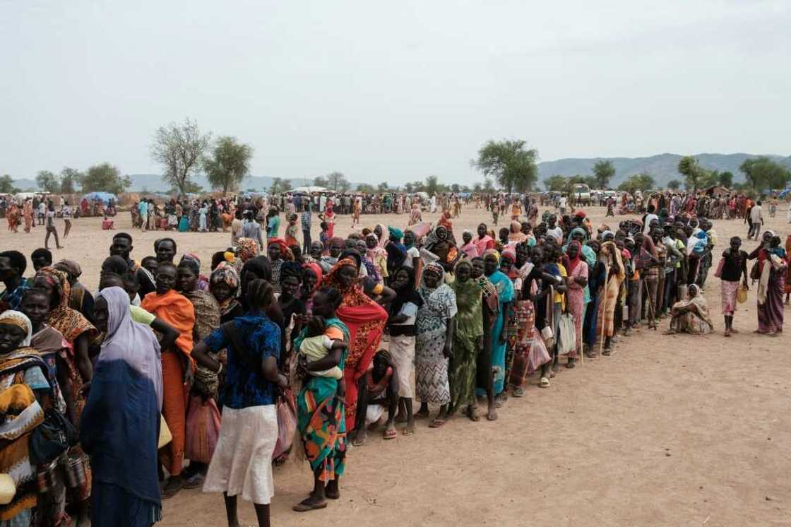 People line up to register for potential food aid delivery at a camp for internally displaced persons in Agari, South Kordofan, on June 17, 2024 People line up to register for potential food aid delivery at a camp for internally displaced persons in Agari, South Kordofan, on June 17, 2024