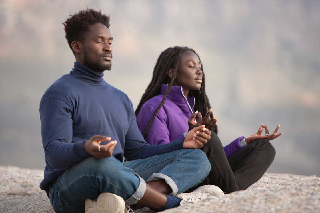 Couple doing yoga Couple doing yoga