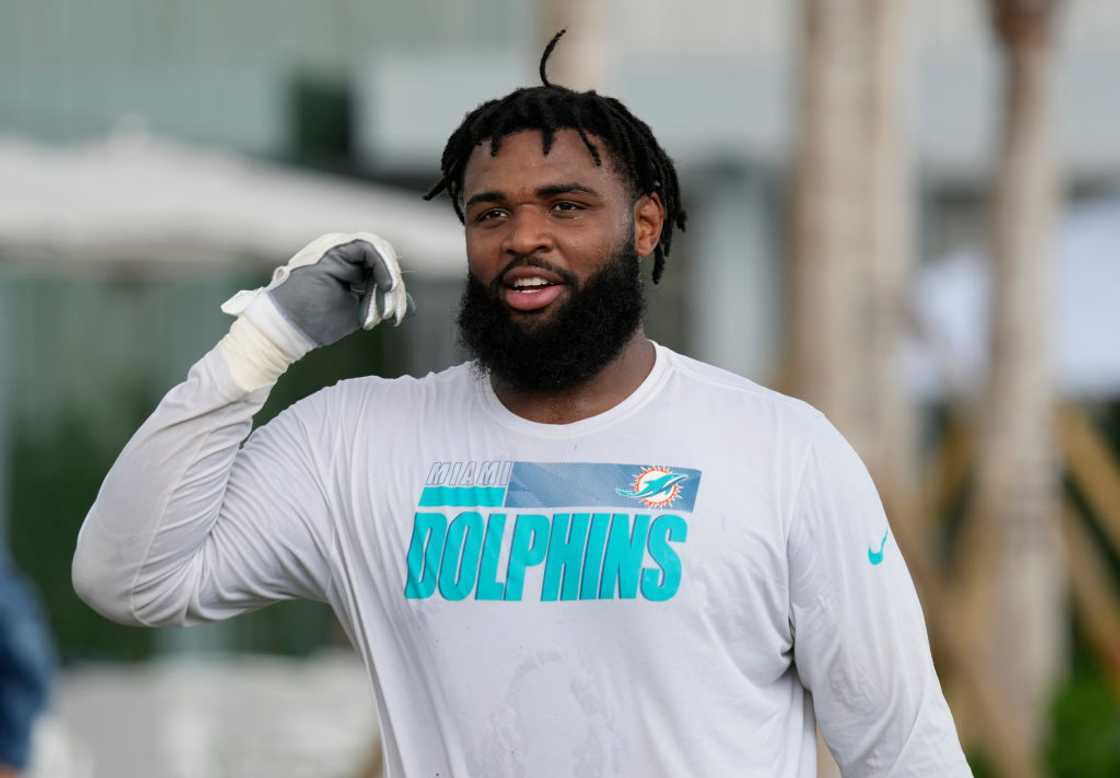 Christian Wilkins heading over to meet with the media after practice during Training Camp Christian Wilkins heading over to meet with the media after practice during Training Camp