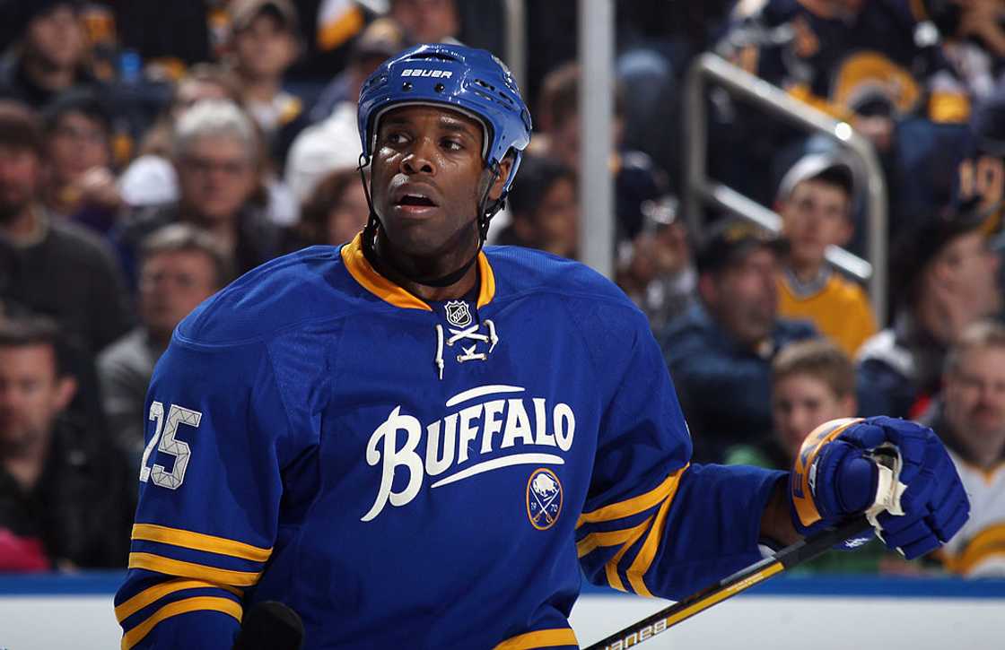 Mike Grier skates in his 1000th NHL game against the Boston Bruins at the HSBC Arena