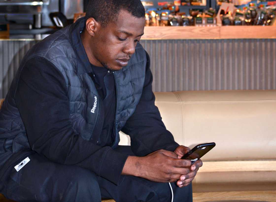 A man using a smartphone A man using a smartphone