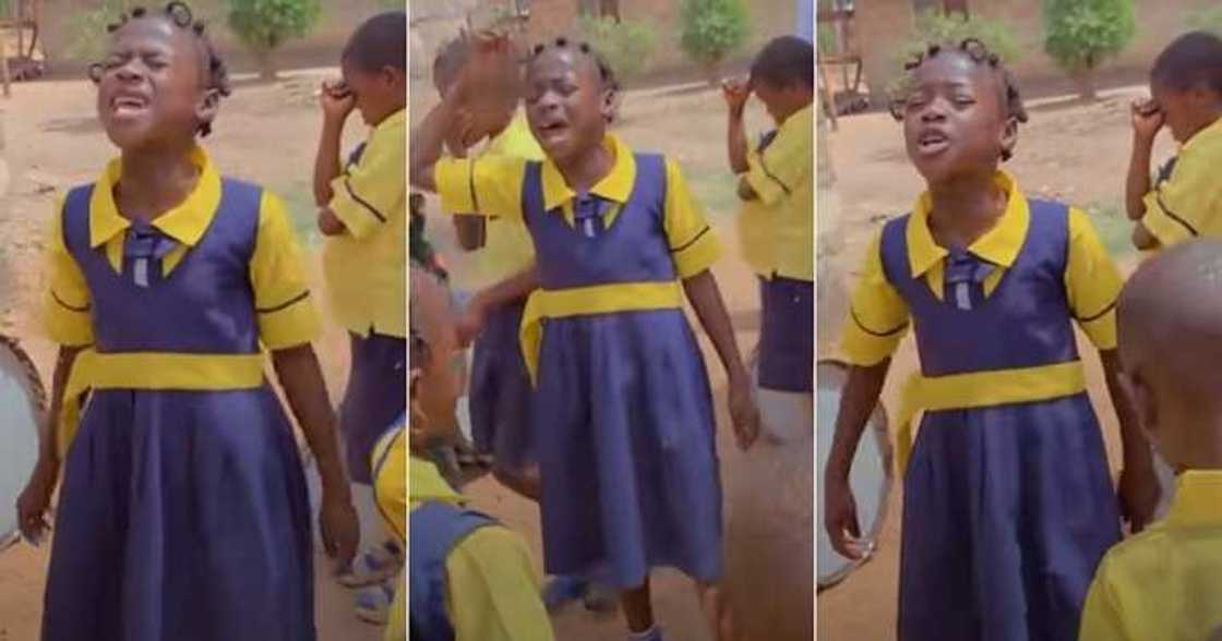 Little girl prays during assembly