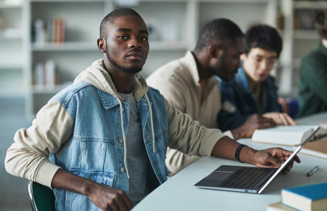 A university student using a laptop in class A university student using a laptop in class