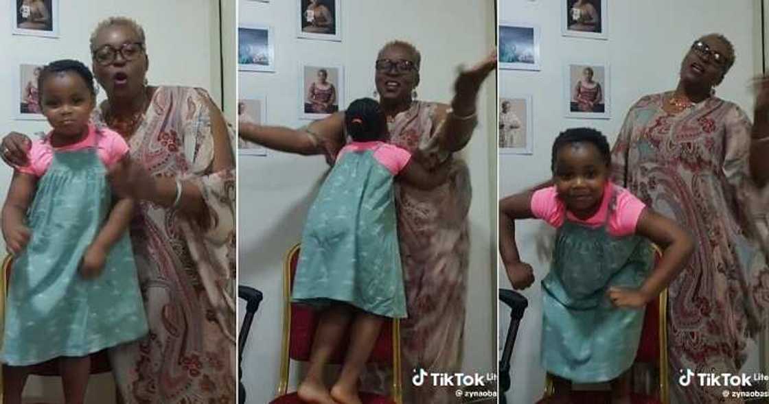 Nigerian mum dances with her adopted child Nigerian mum dances with her adopted child