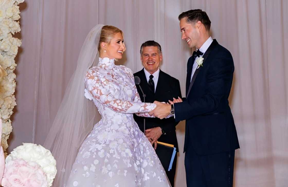 Paris Hilton and Carter Reum hold hands on their wedding day Paris Hilton and Carter Reum hold hands on their wedding day