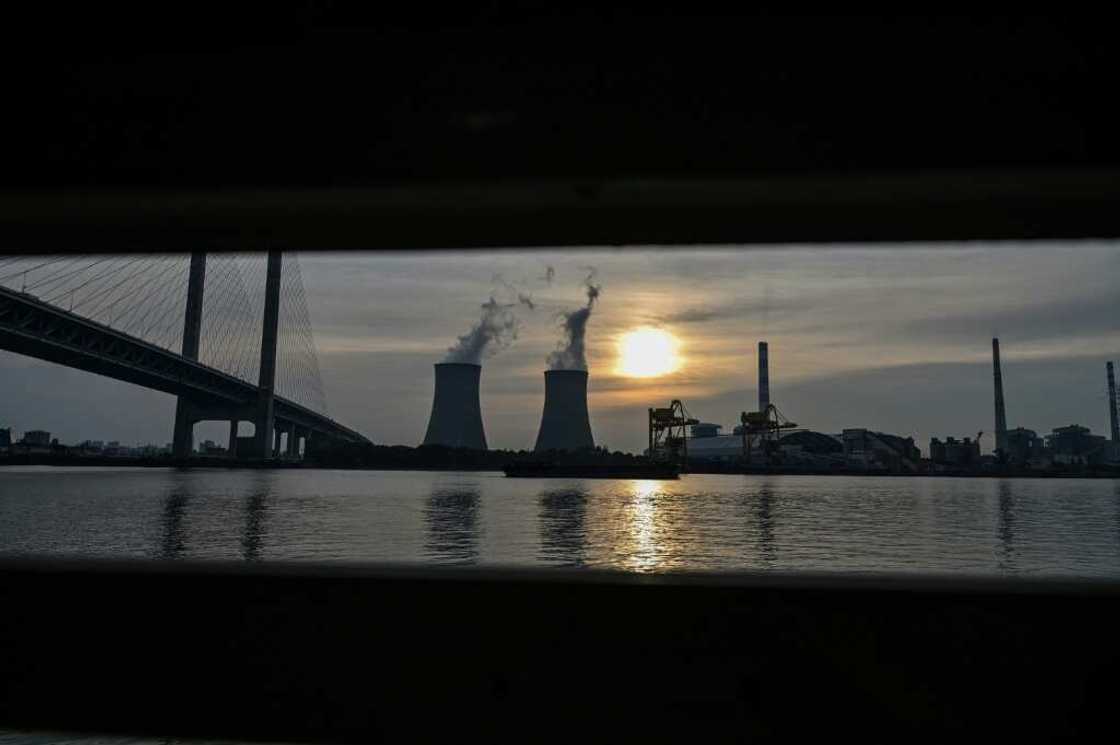 The Wujing coal-electricity power station seen from a ferry window in Minhang district of Shanghai on August 22, 2022 -- China's unwillingness to let go of coal stems partly from inefficiencies in its power grid The Wujing coal-electricity power station seen from a ferry window in Minhang district of Shanghai on August 22, 2022 -- China's unwillingness to let go of coal stems partly from inefficiencies in its power grid
