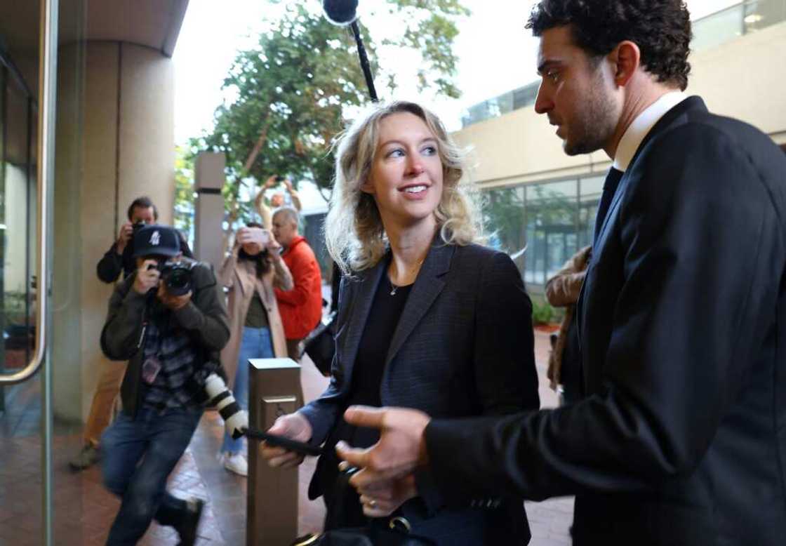 Former Theranos CEO Elizabeth Holmes arrives at court with her partner Billy Evans in October 2022 in San Jose, California Former Theranos CEO Elizabeth Holmes arrives at court with her partner Billy Evans in October 2022 in San Jose, California