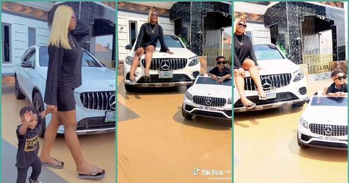 Mother and son with swag show off their white Benz
