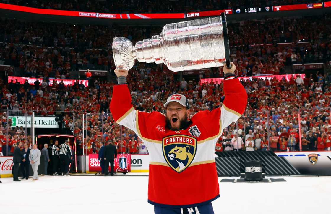 Kyle Okposo celebrates with the Stanley Cup following a 2-1 victory over the Edmonton Oilers