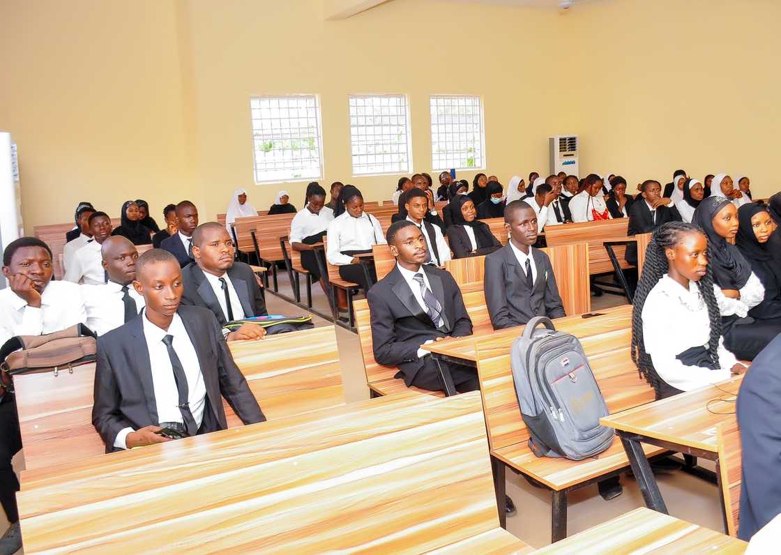 Law students sit in a hall setting