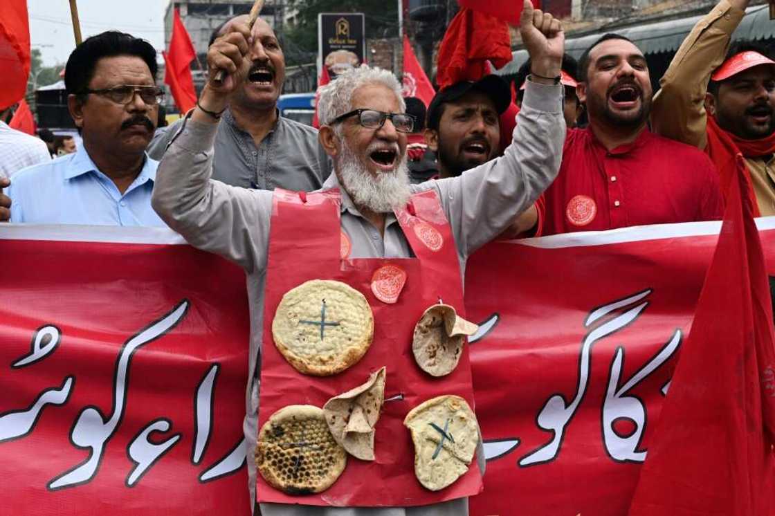 Union activists march during a May day protest in Lahore. Runaway inflation has send prices soaring for Pakistanis -- especially the poor and marginalised Union activists march during a May day protest in Lahore. Runaway inflation has send prices soaring for Pakistanis -- especially the poor and marginalised