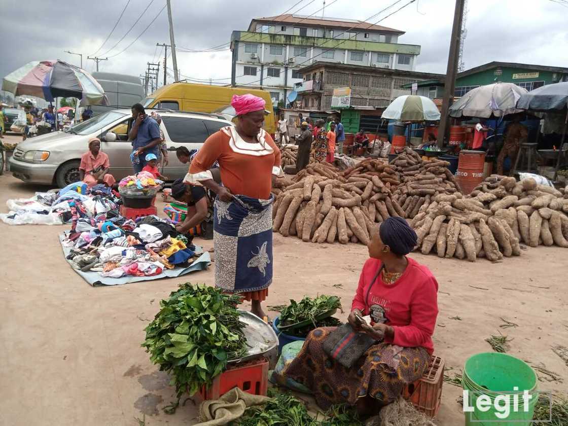 Yam, vegetable seller, Lagos market Yam, vegetable seller, Lagos market