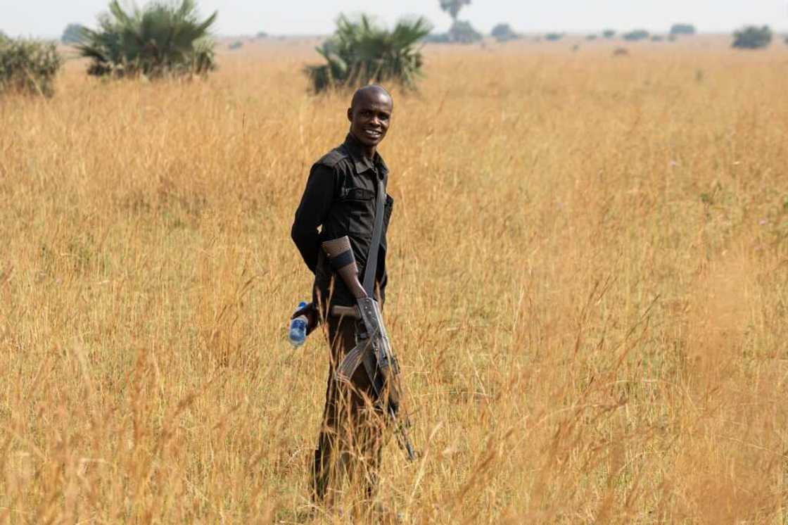 A soldier attached to Uganda Wildlife Authority (UWA) guarding the well pad