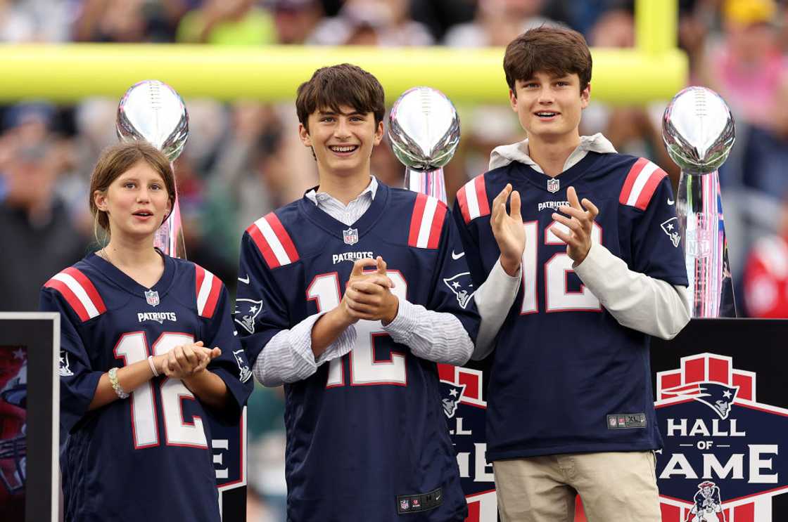 Benjamin Rein Brady (C) and his siblings attend an NFL game in Foxborough, Massachusetts
