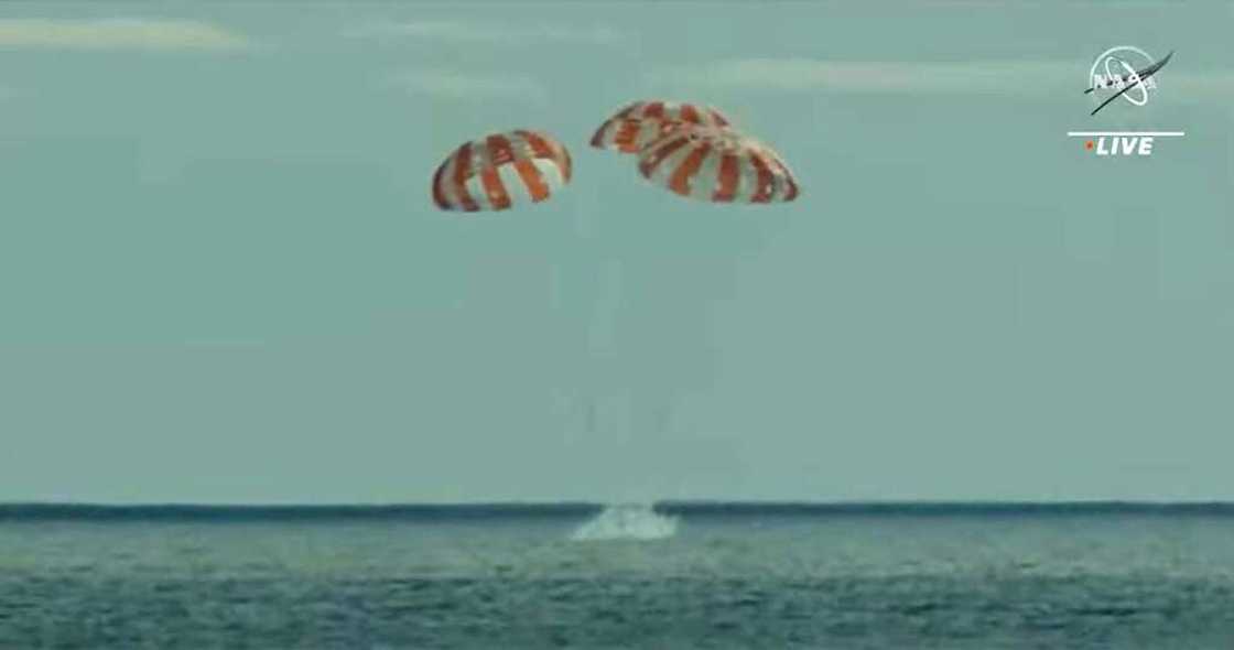 In this still image taken from NASA TV, NASA's unmanned Orion spaceship splashes down in the Pacific Ocean off Baja California, Mexico, on December 11, 2022