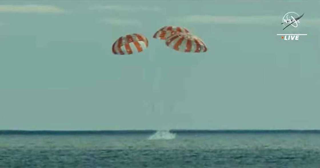In this still image taken from NASA TV, NASA's unmanned Orion spaceship splashes down in the Pacific Ocean off Baja California, Mexico, on December 11, 2022 In this still image taken from NASA TV, NASA's unmanned Orion spaceship splashes down in the Pacific Ocean off Baja California, Mexico, on December 11, 2022