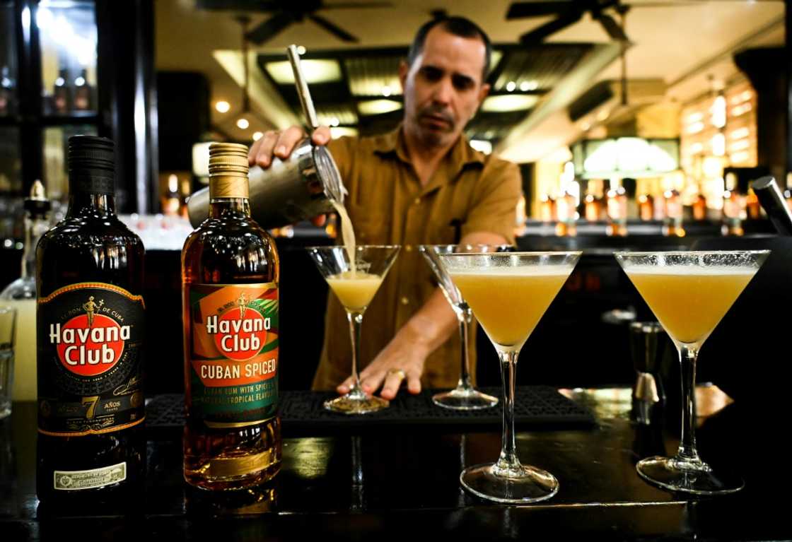 A bartender prepares a cocktail with the new Havana Club Cuban Spiced rum at Havana's rum museum in 2022