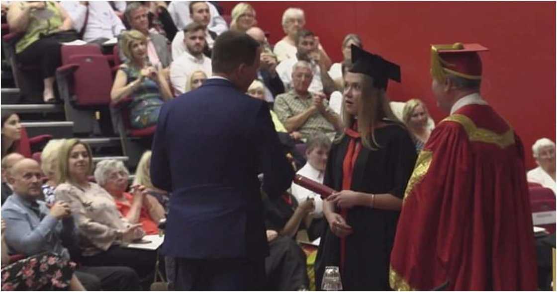 Double celebration as man proposes to girlfriend during her graduation Double celebration as man proposes to girlfriend during her graduation