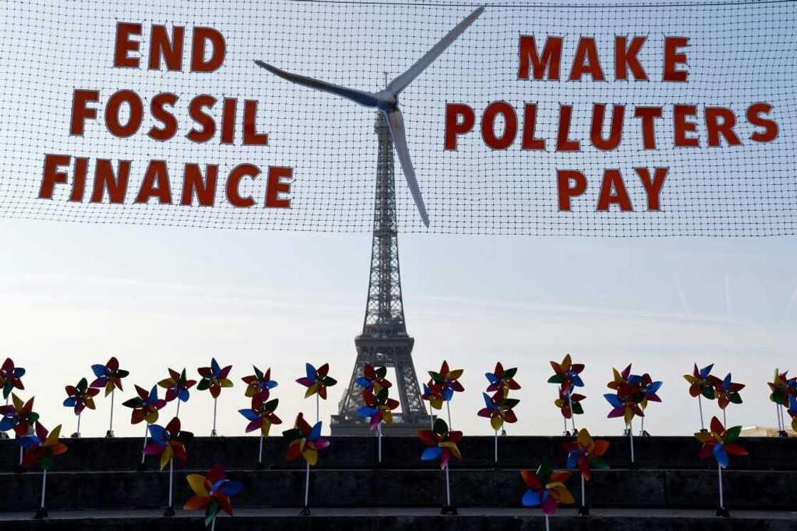 Activists demonstrated against fossil fuel finance in central Paris on the eve of the summit Activists demonstrated against fossil fuel finance in central Paris on the eve of the summit