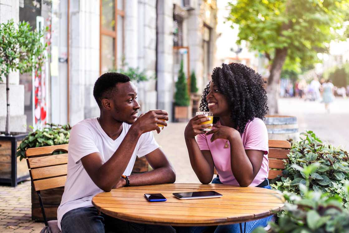 Two people at a cafe Two people at a cafe