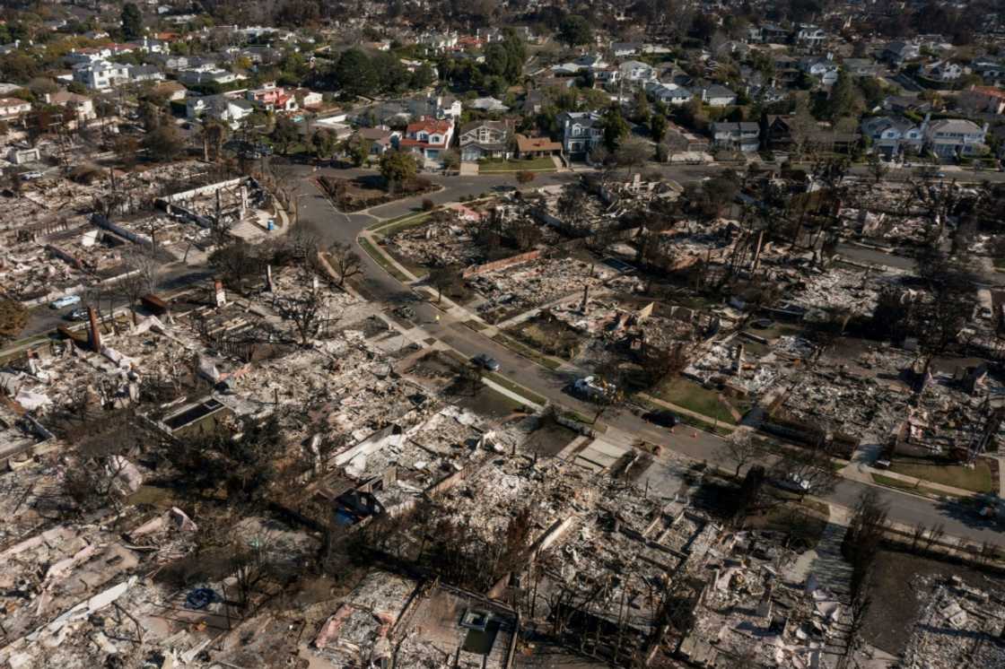 An aerial image shows homes damaged and destroyed by the Palisades Fire in the Pacific Palisades neighborhood of Los Angeles, California, on January 29, 2025. An aerial image shows homes damaged and destroyed by the Palisades Fire in the Pacific Palisades neighborhood of Los Angeles, California, on January 29, 2025.