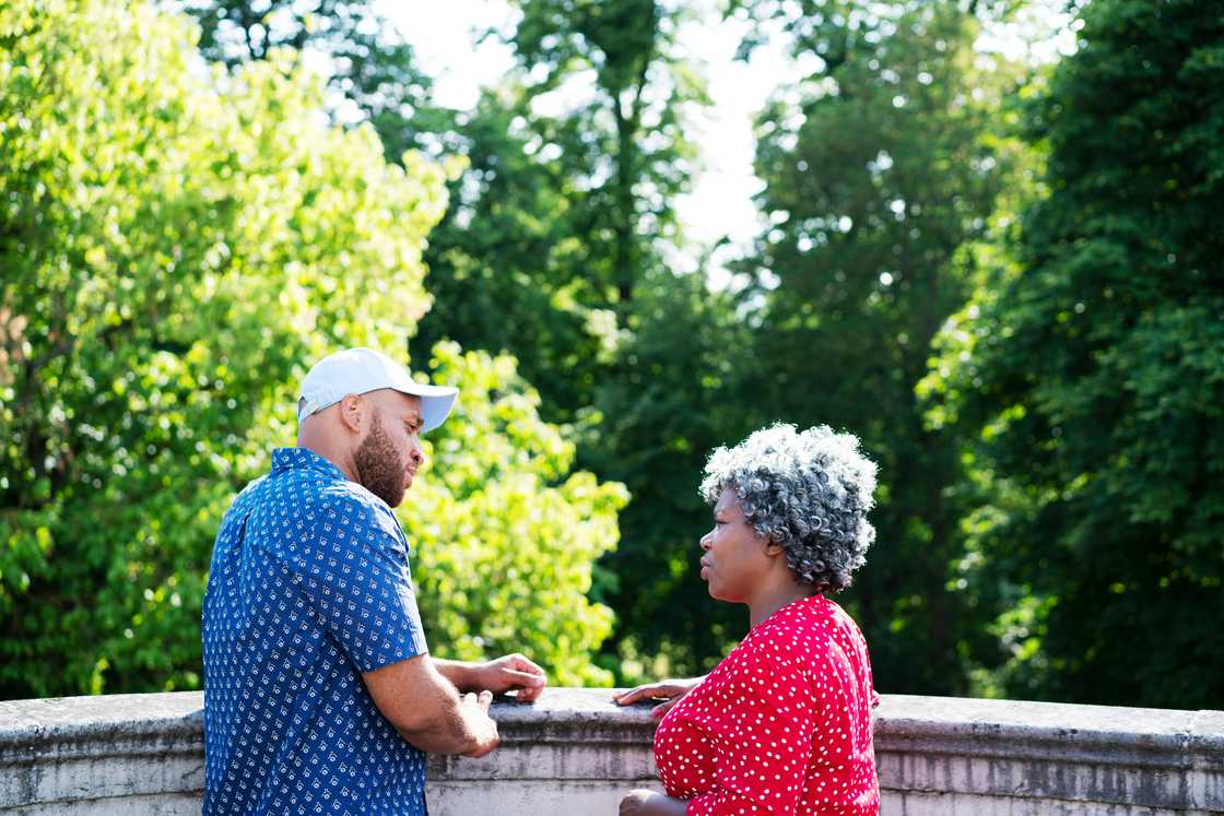 A mother talking to her son A mother talking to her son