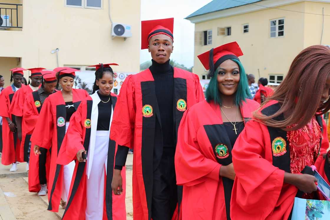 Students wearing red and black matriculation gowns at the University of Africa, Toru-orua. Students wearing red and black matriculation gowns at the University of Africa, Toru-orua.